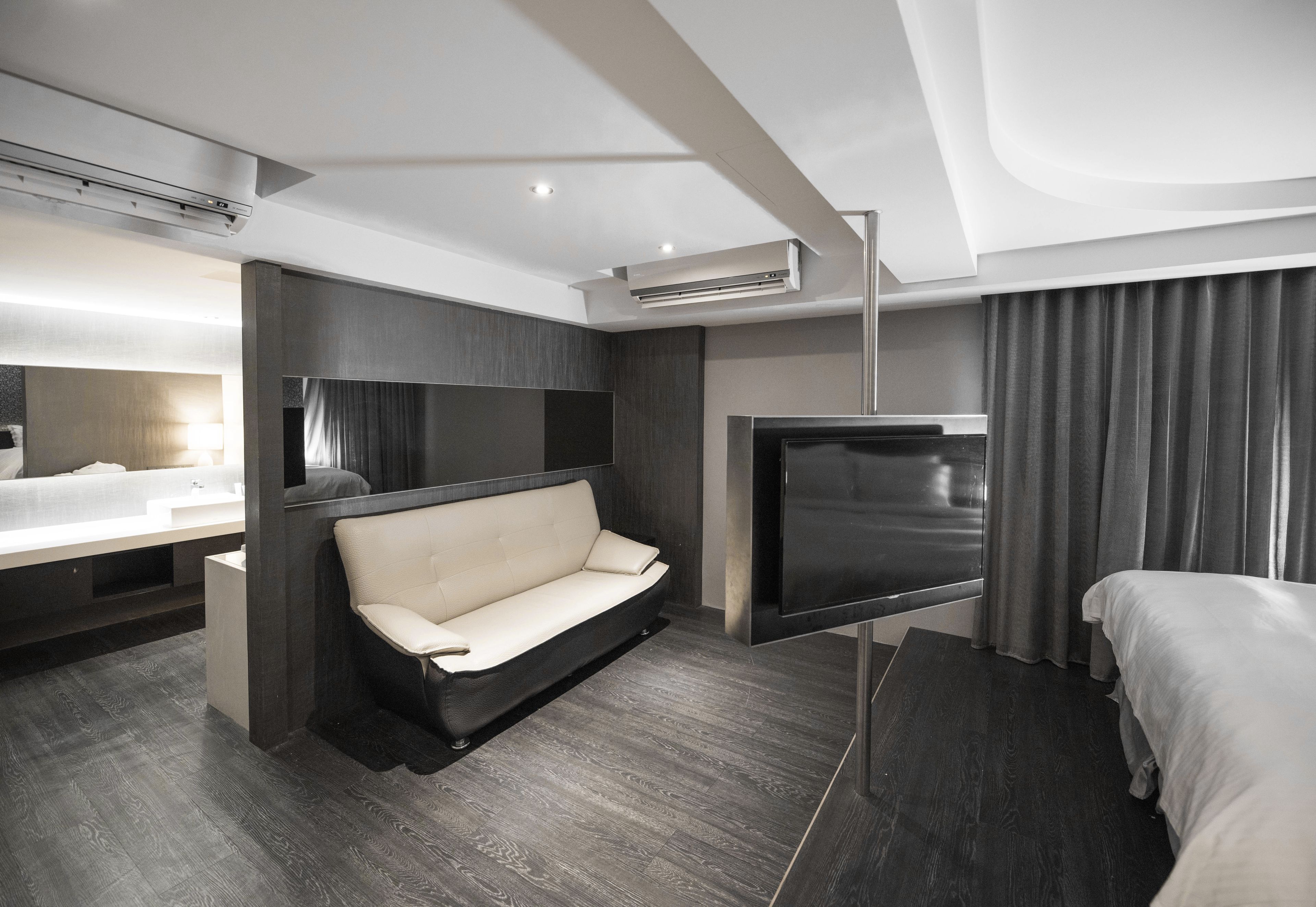 Family Quadruple Room (stairs from 6F-7F) | Living area | Flat-screen TV, DVD player