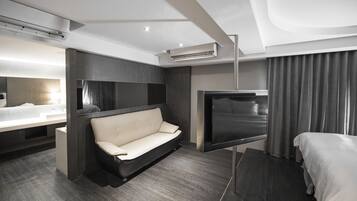 Family Quadruple Room (stairs from 6F-7F) | Living area | Flat-screen TV, DVD player