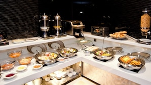 A buffet with various food options, including salads, meats, and hot dishes. - Saual Keh Hotel (Taipei)