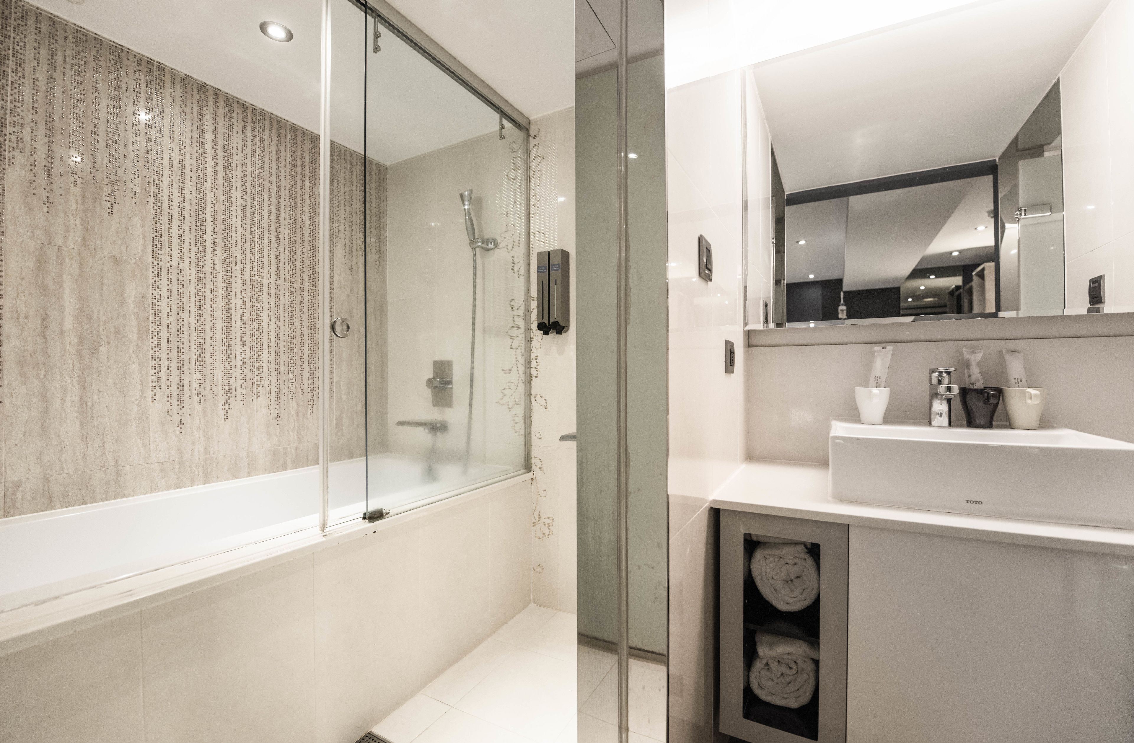 Triple Room, No Windows (B1 Floor) | Bathroom | Combined shower/tub, rainfall showerhead, free toiletries, hair dryer