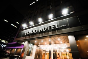 The exterior of Yando Hotel with illuminated signage and a modern facade. - Yoido Hotel (Seoul)