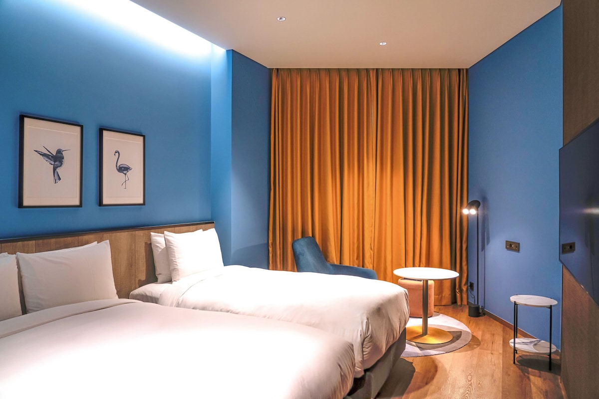 Premium Room, Multiple Beds | Down comforters, minibar (free items), in-room safe, blackout drapes