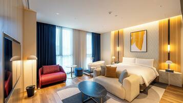Suite, 1 King Bed with Sofa bed | 1 bedroom, free minibar, in-room safe, blackout curtains