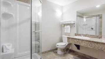 Suite, 1 King Bed, Non Smoking, Jetted Tub | Bathroom | Combined shower/tub, free toiletries, hair dryer, towels