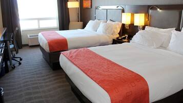 Premium bedding, desk, laptop workspace, blackout drapes