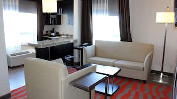 Deluxe Room with Separate Bedroom, Jetted tub and Fireplace | Living room | 37-inch LCD TV with digital channels