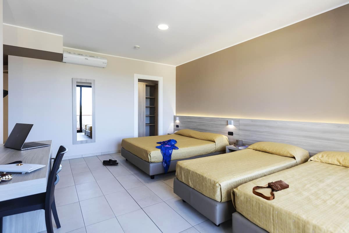 Standard Quadruple Room | Minibar, in-room safe, desk, soundproofing