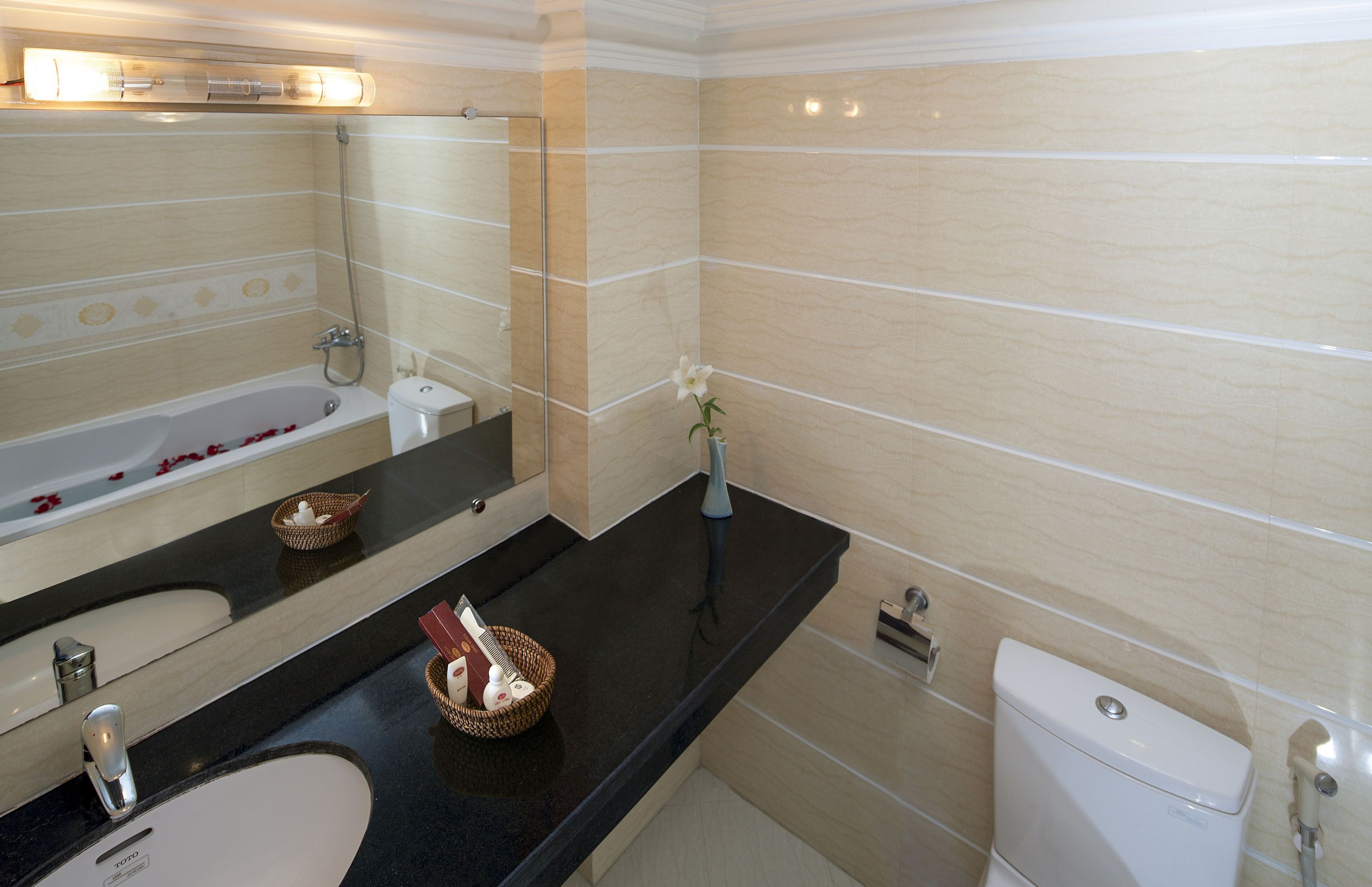 bathtub, designer toiletries, hair dryer, bathrobes