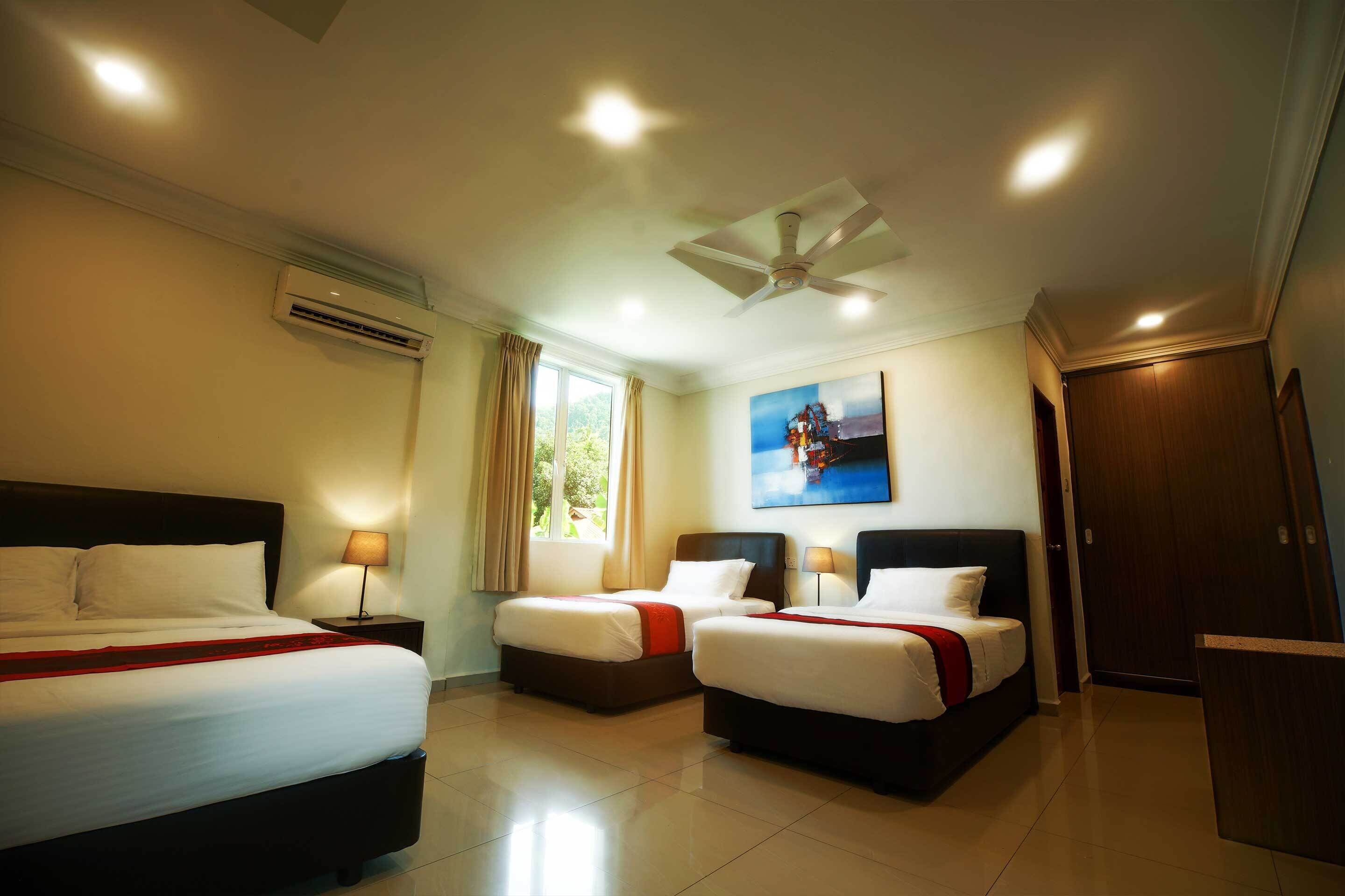 deluxe quadruple room (with a/c) | memory-foam beds, in-room safe, desk, blackout curtains