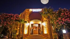 The Moonshine Hotel & Suites entrance with a full moon in the background. - Moonshine Hotel & Suites (Bodrum)