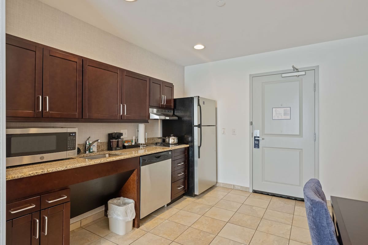 full-sized fridge, microwave, stovetop, dishwasher