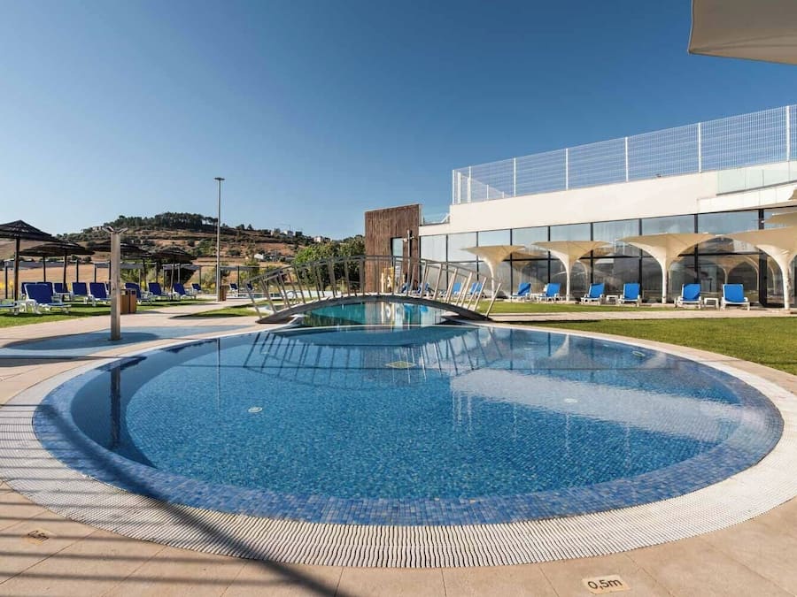 Seasonal outdoor pool, open 9:00 AM to 7:30 PM, pool umbrellas