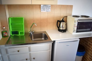 Fridge, stovetop, coffee/tea maker, electric kettle