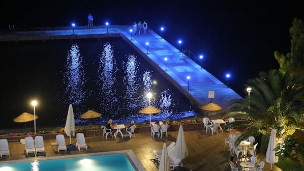 Seasonal outdoor pool, pool umbrellas, pool loungers