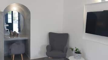 Habitación superior | Zona de estar | Una televisión de pantalla plana