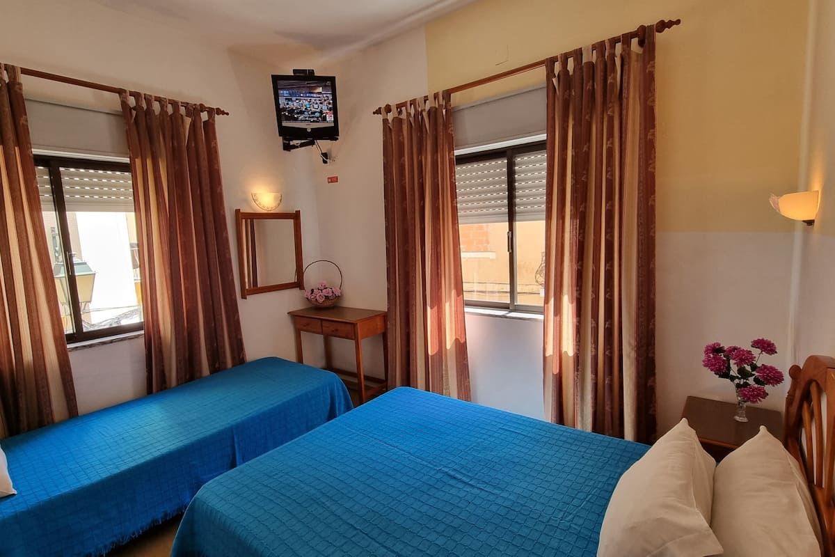 Economy Triple Room, Private Bathroom | Desk, blackout drapes, free WiFi, bed sheets
