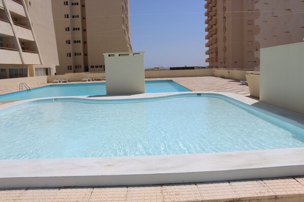 2 outdoor pools, pool umbrellas, pool loungers