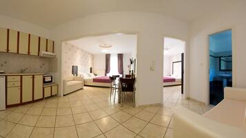 Luxury Apartment, Multiple Beds | Private kitchen | Full-size fridge, stovetop, coffee/tea maker, electric kettle