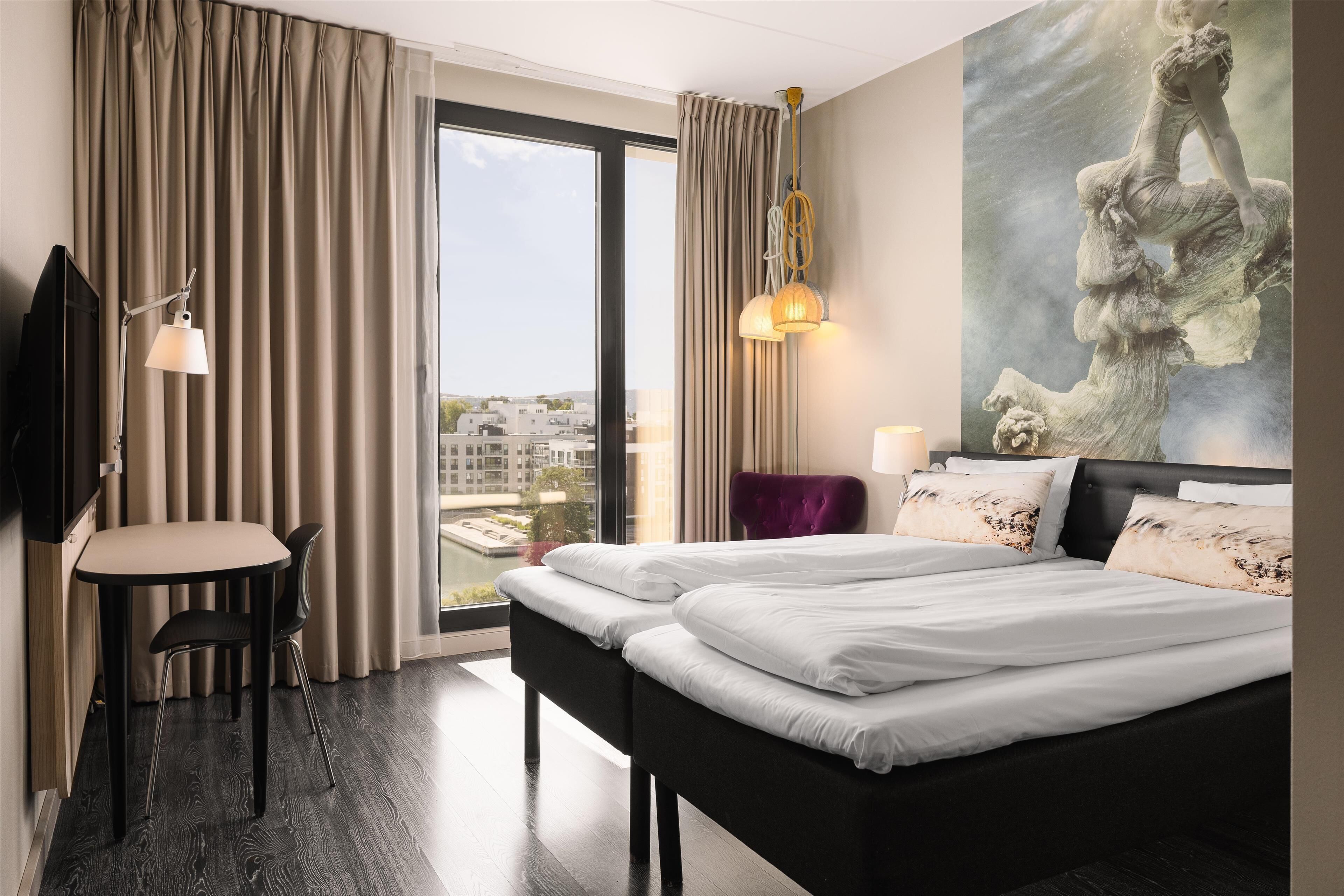 standard twin room | desk, laptop workspace, blackout curtains, iron/ironing board