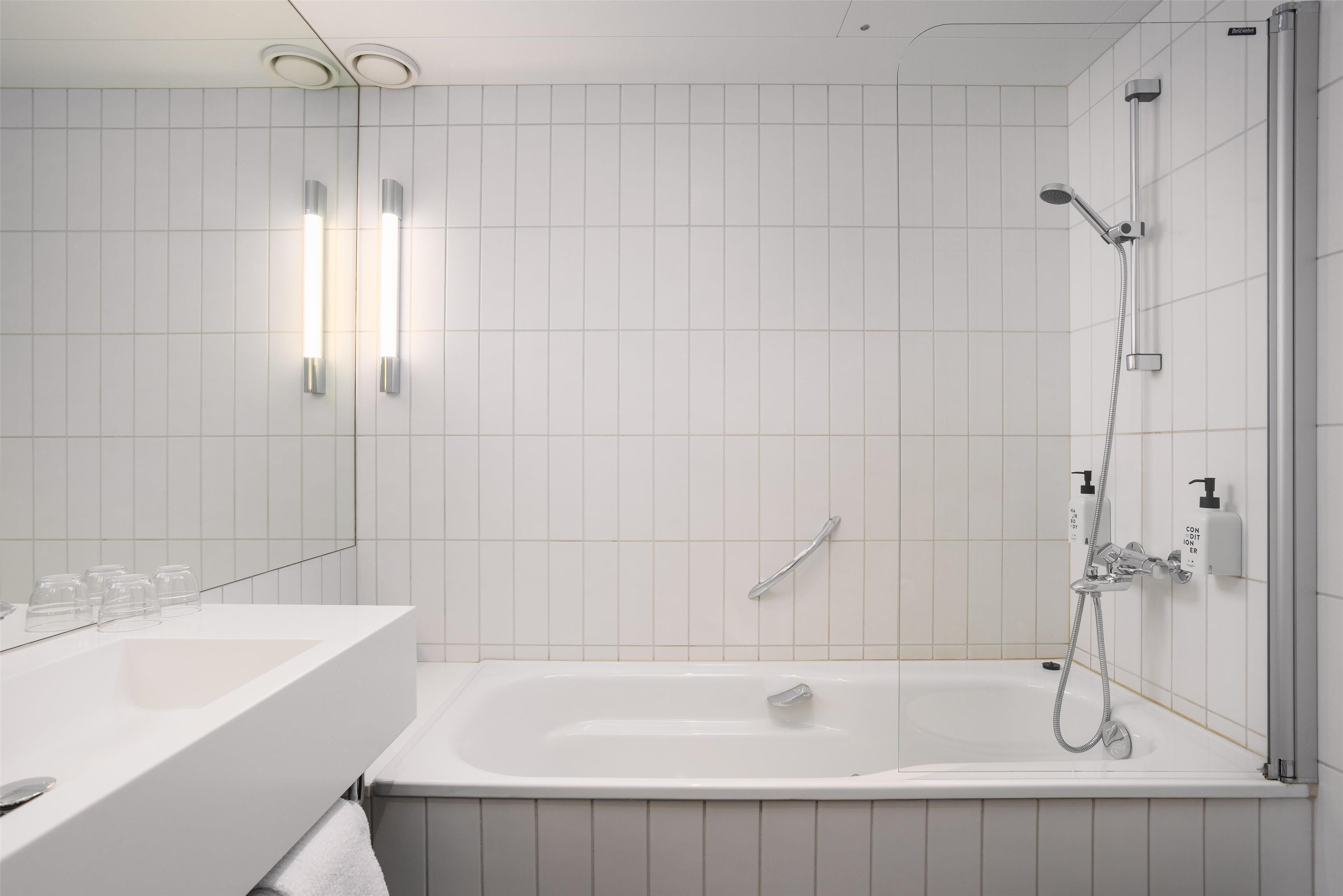 superior twin room | bathroom | hair dryer, towels, soap, shampoo