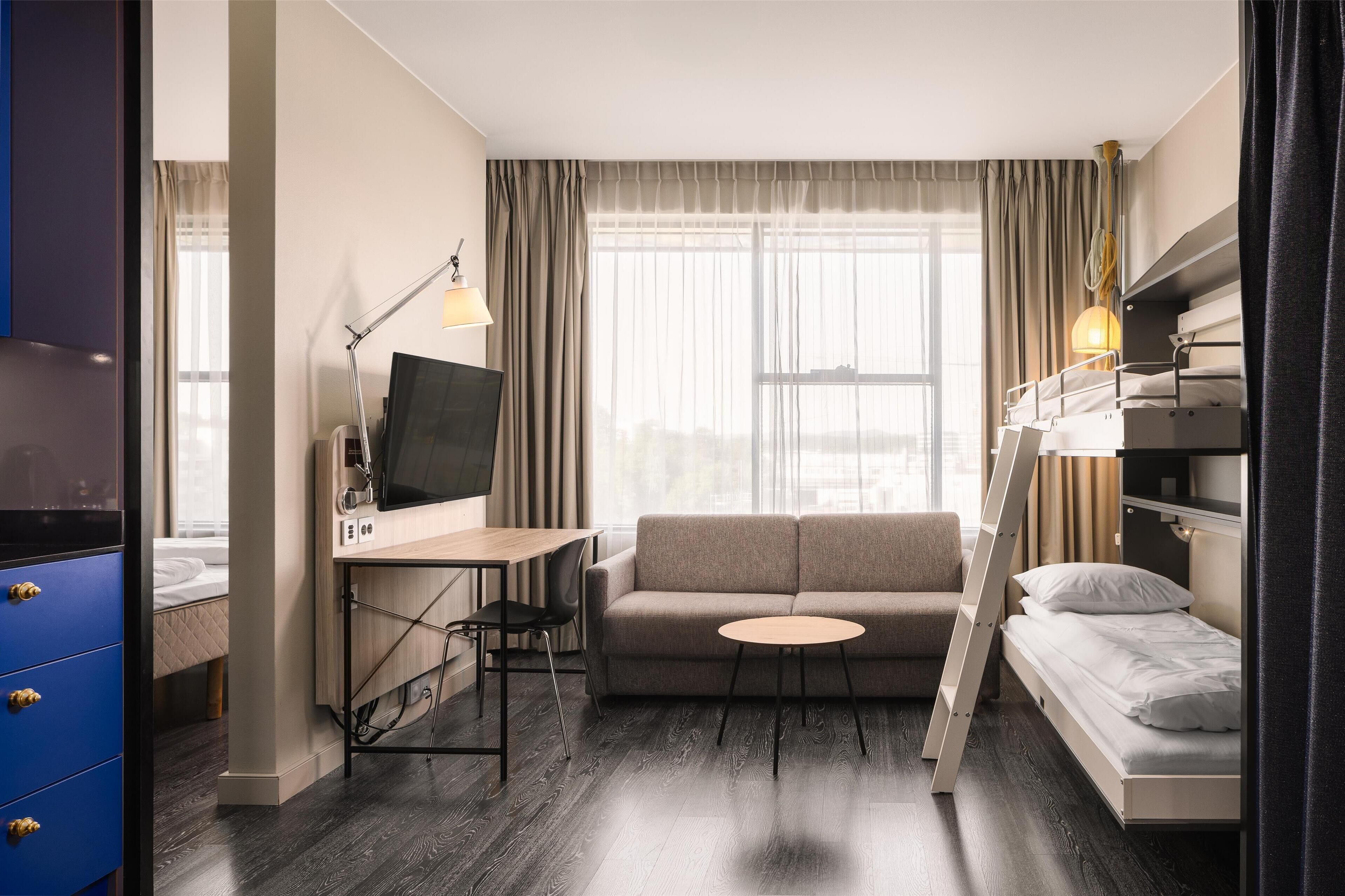 family room | desk, laptop workspace, blackout curtains, iron/ironing board