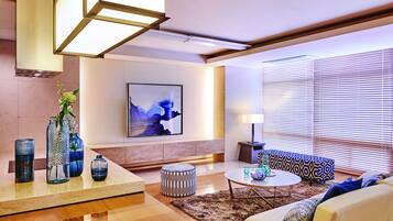 A modern living room with a sofa, coffee table, and decorative vases.