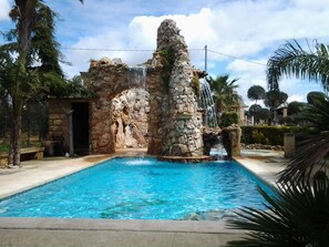 Seasonal outdoor pool, pool loungers