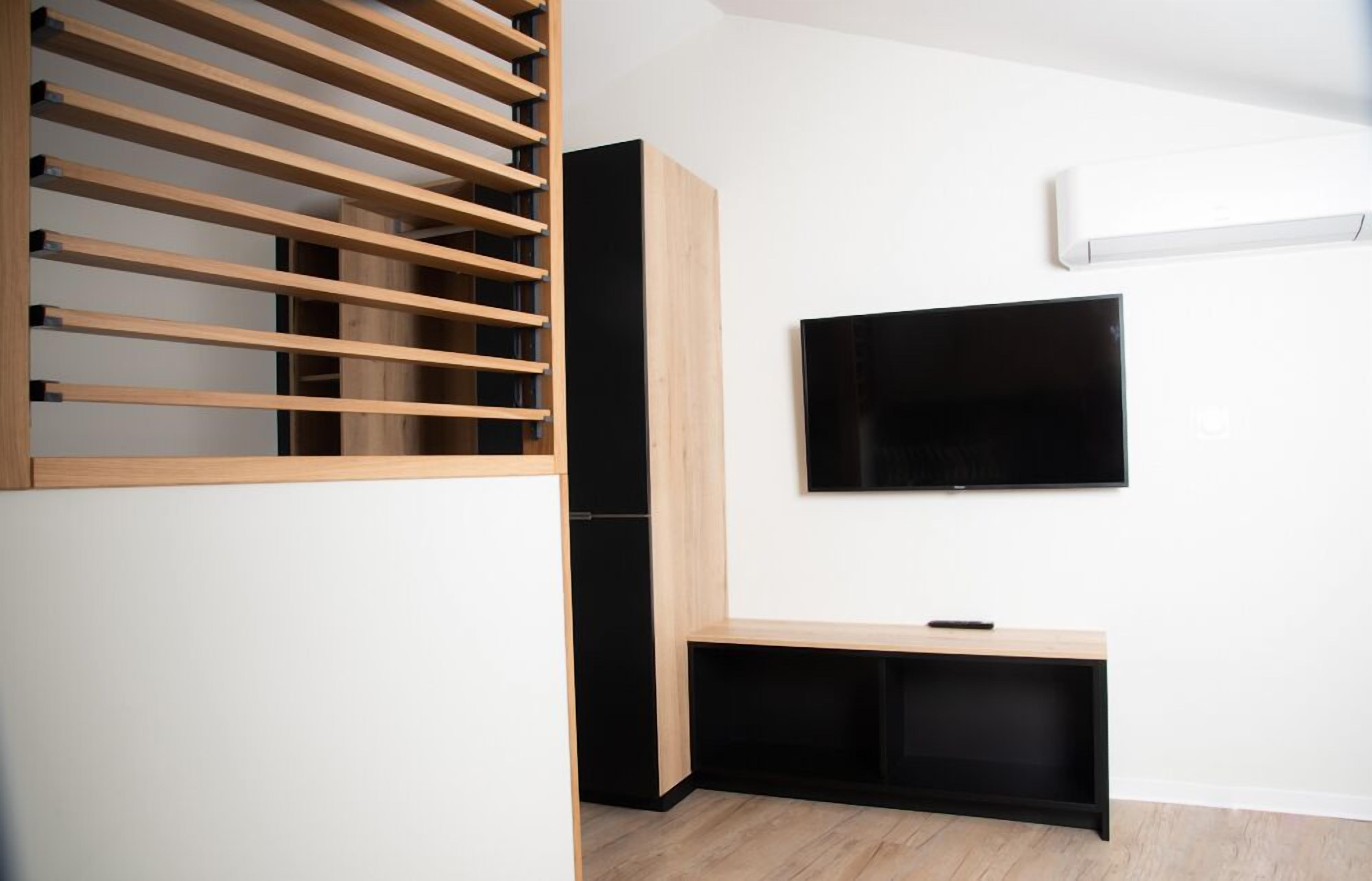 comfort duplex | living area | flat-screen tv