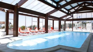 Indoor pool, open 9 AM to 9 PM, pool umbrellas, pool loungers