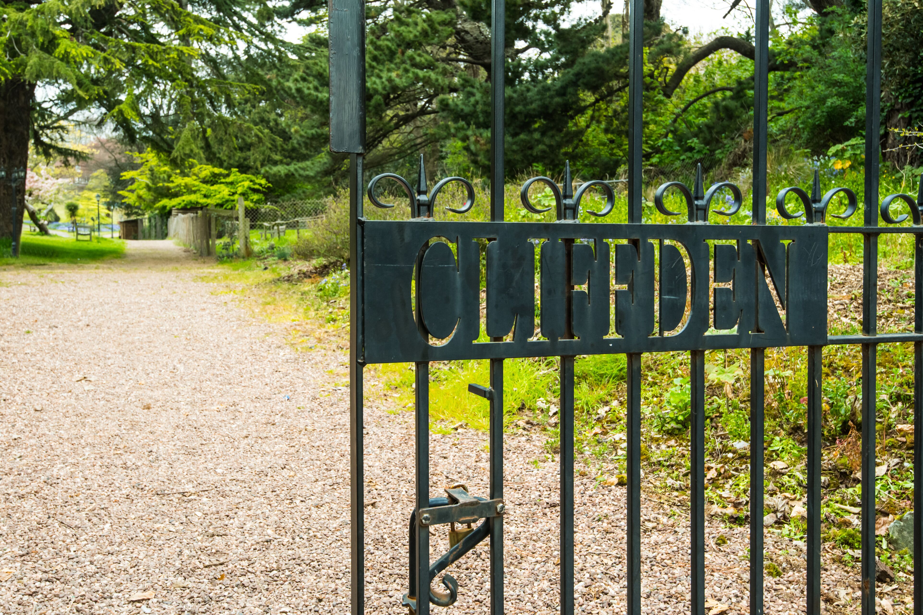 A metal gate with the name "CLIFFDEN" engraved on it.