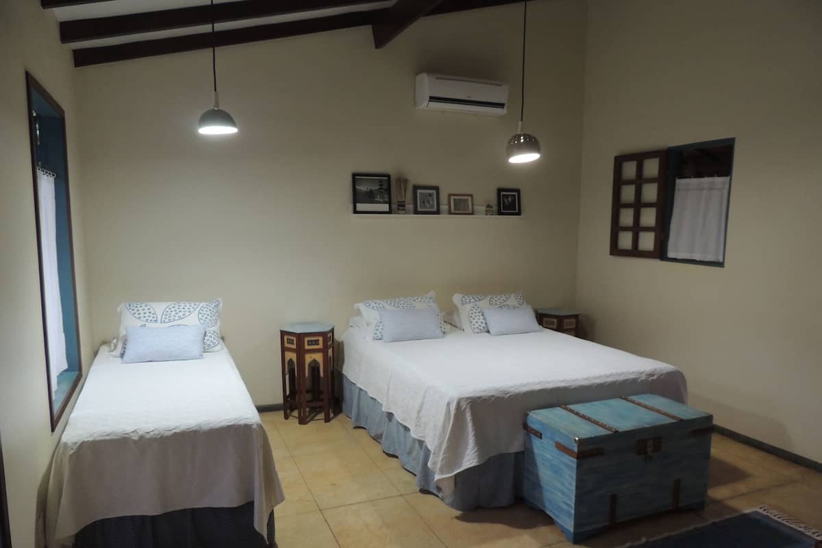 Family Triple Room, Garden View (Chale) | Minibar, laptop workspace, soundproofing, free WiFi