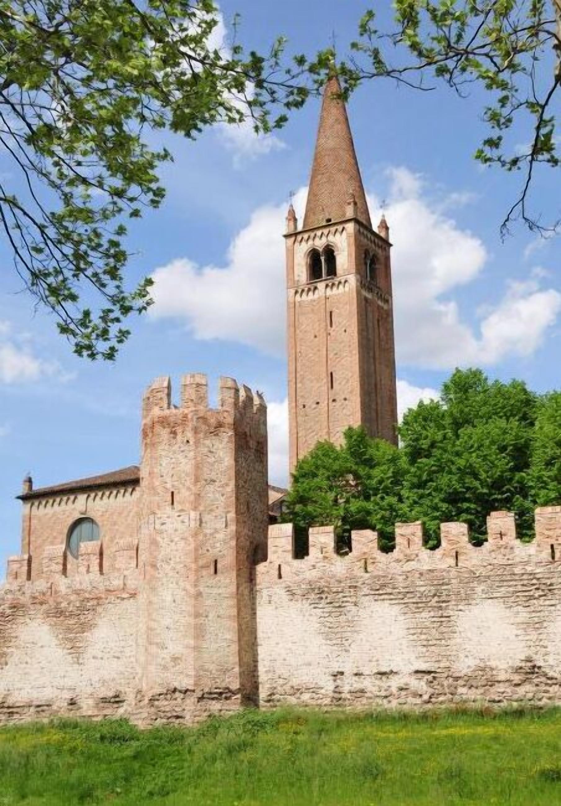 A historic stone castle with a prominent tower and a fortified wall.