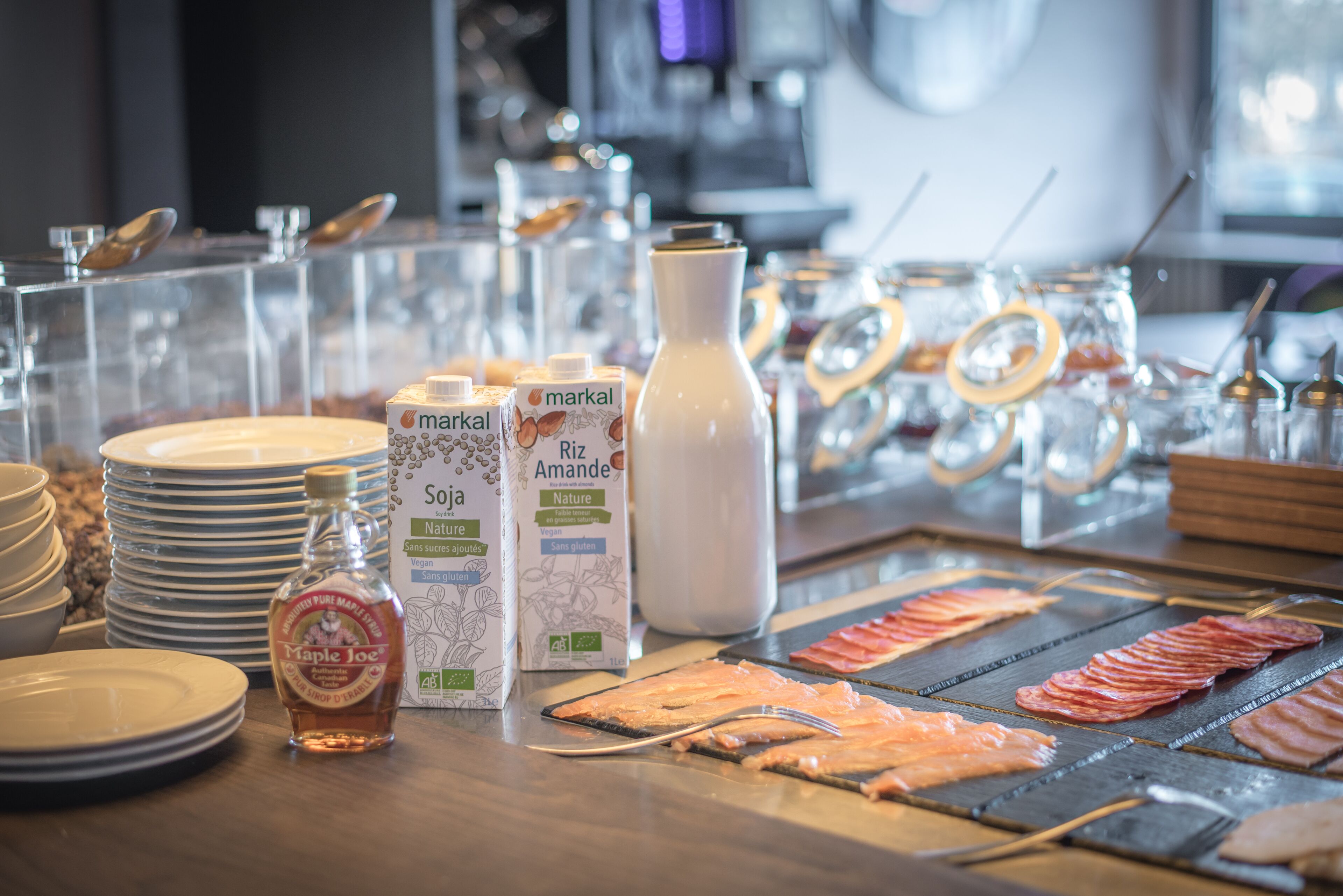 A buffet setup with various food items and beverages.