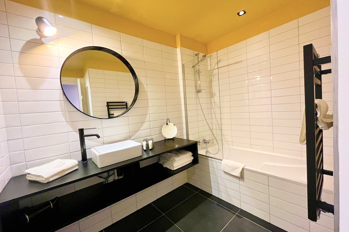 deluxe quadruple room | bathroom | free toiletries, hair dryer, towels