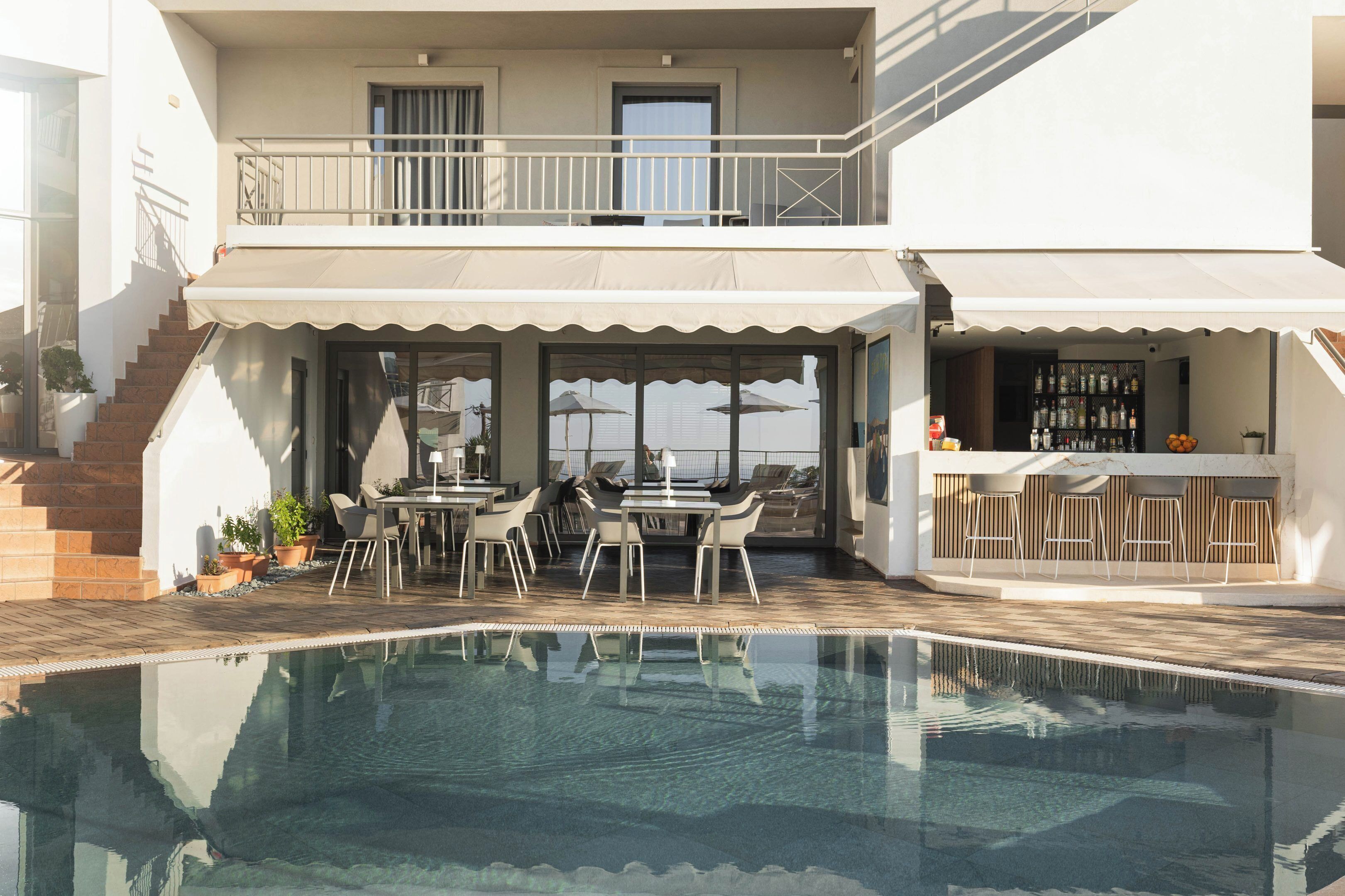 Seasonal outdoor pool, pool umbrellas, pool loungers