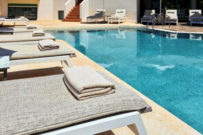 Seasonal outdoor pool, pool umbrellas, pool loungers