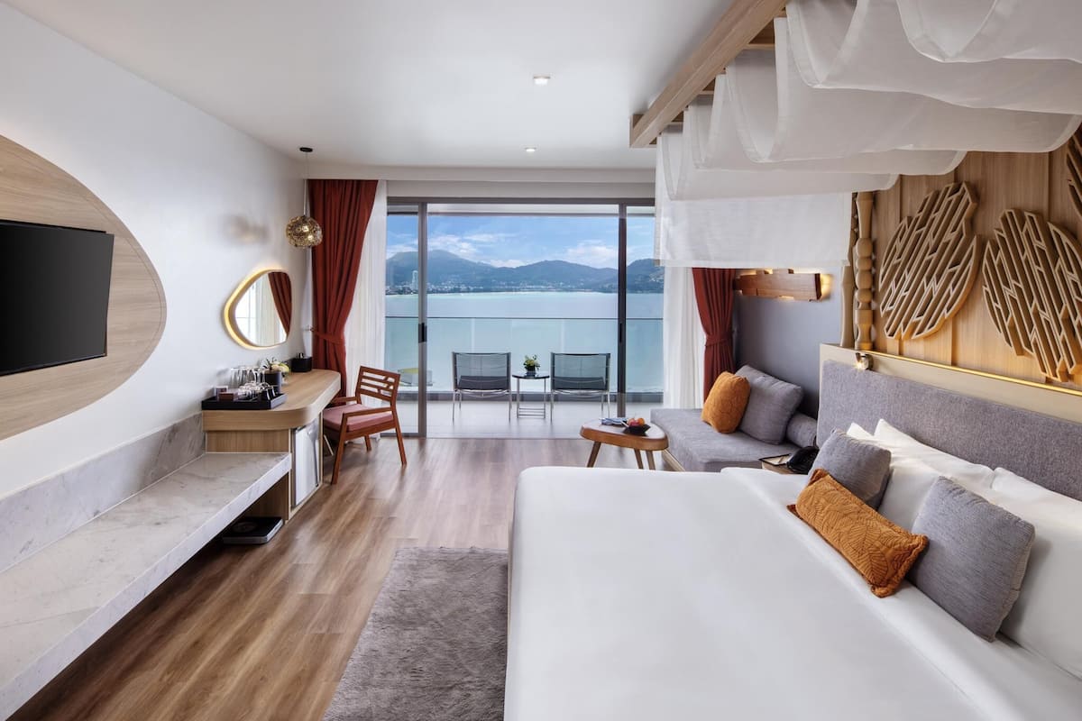 romance room with ocean view | premium bedding, minibar, in-room safe, individually decorated