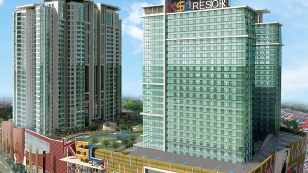 A high-rise hotel with a modern glass facade and a prominent 'KSL RESORT' sign.