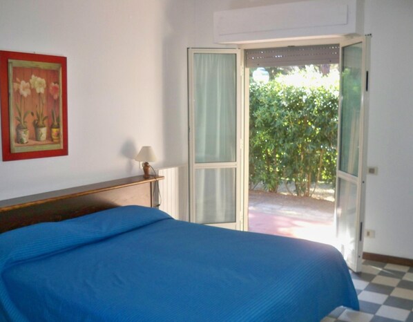 Desk, laptop workspace, bed sheets