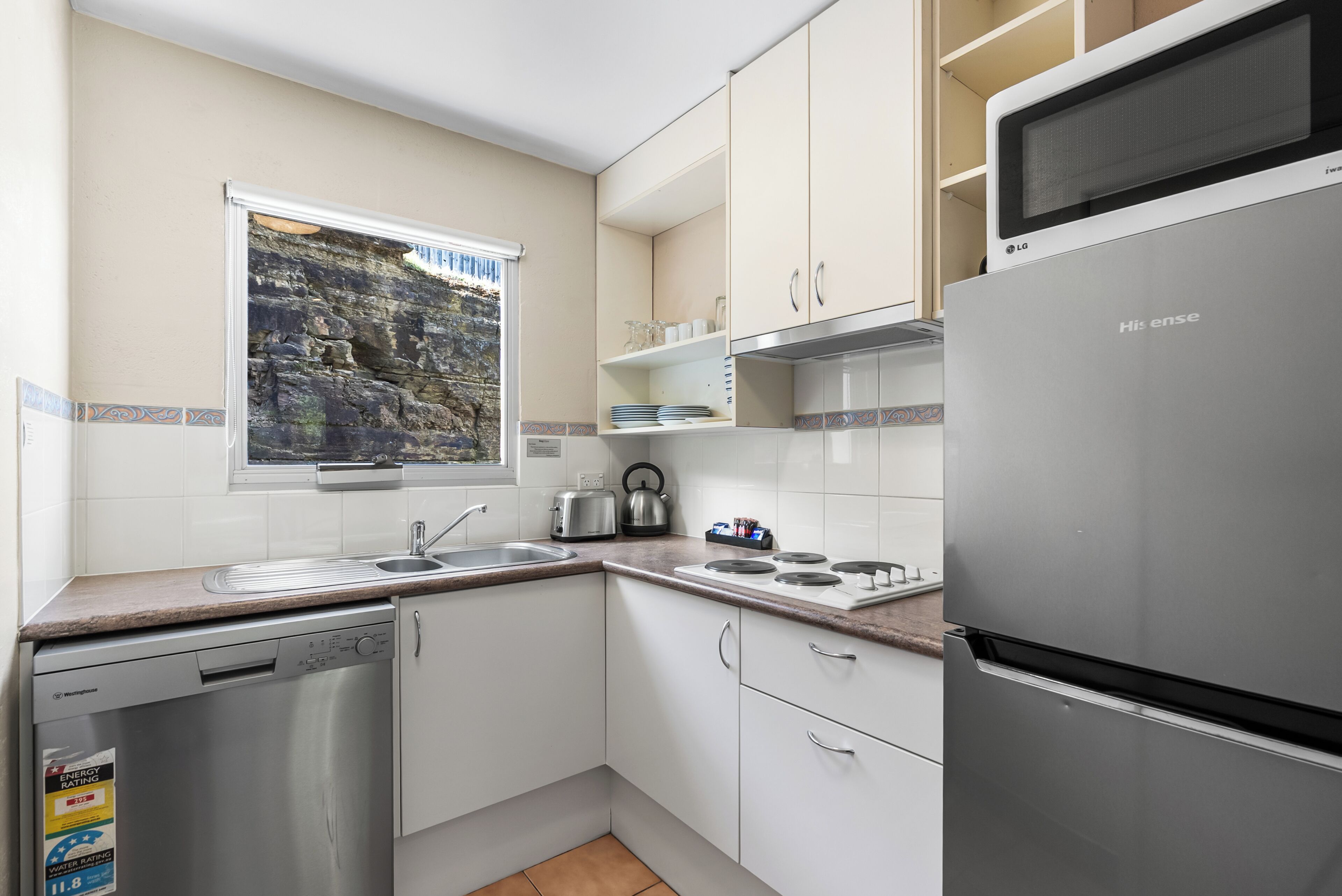 Standard Three Bedroom Apartment | Private kitchen | Fridge, microwave, oven, stovetop