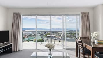 Standard One Bedroom Apartment - Harbour View | Living area | 42-inch flat-screen TV with cable channels, TV, DVD player