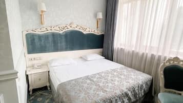 Desk, laptop workspace, free WiFi, bed sheets
