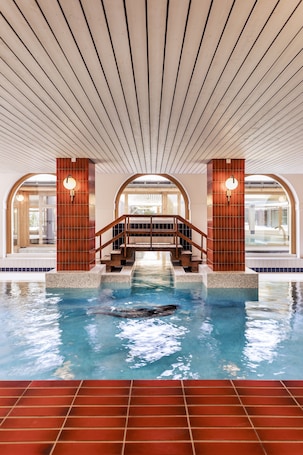 Indoor pool, seasonal outdoor pool, pool umbrellas, pool loungers