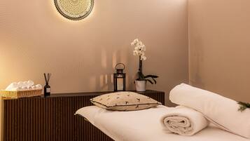 Experience serenity in our spa area, featuring a reception desk, plush towels, and a cozy bench.