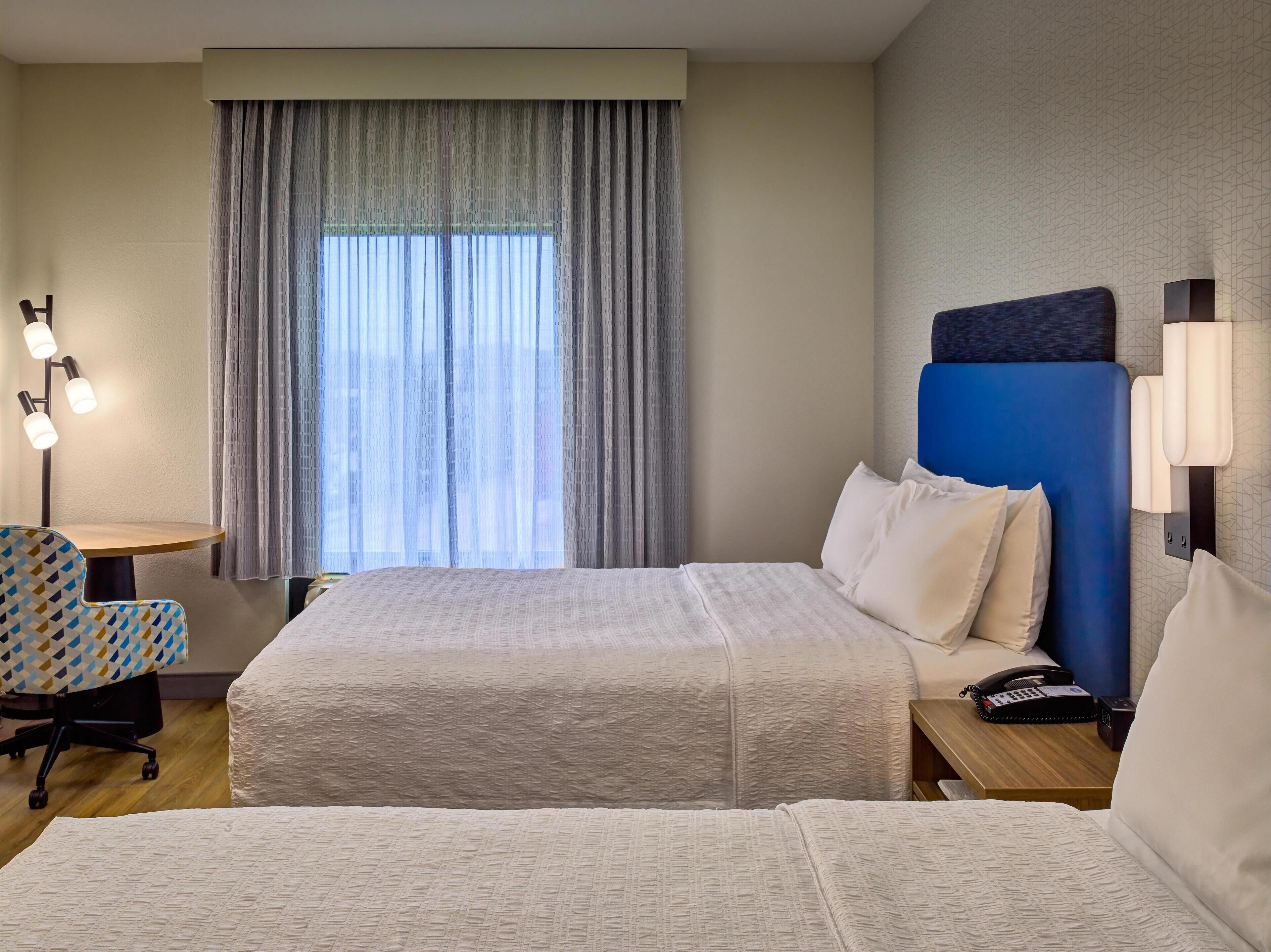 Desk, blackout drapes, iron/ironing board, free cribs/infant beds