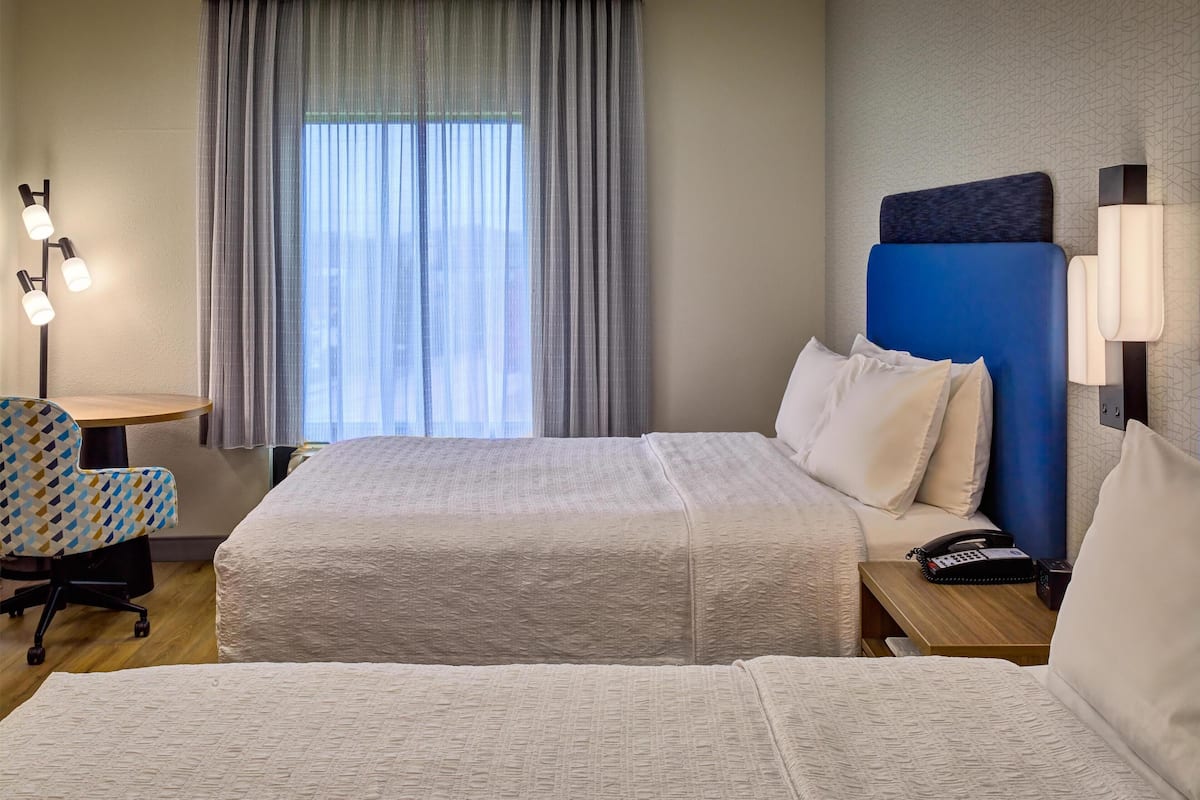 Desk, blackout drapes, iron/ironing board, free cribs/infant beds