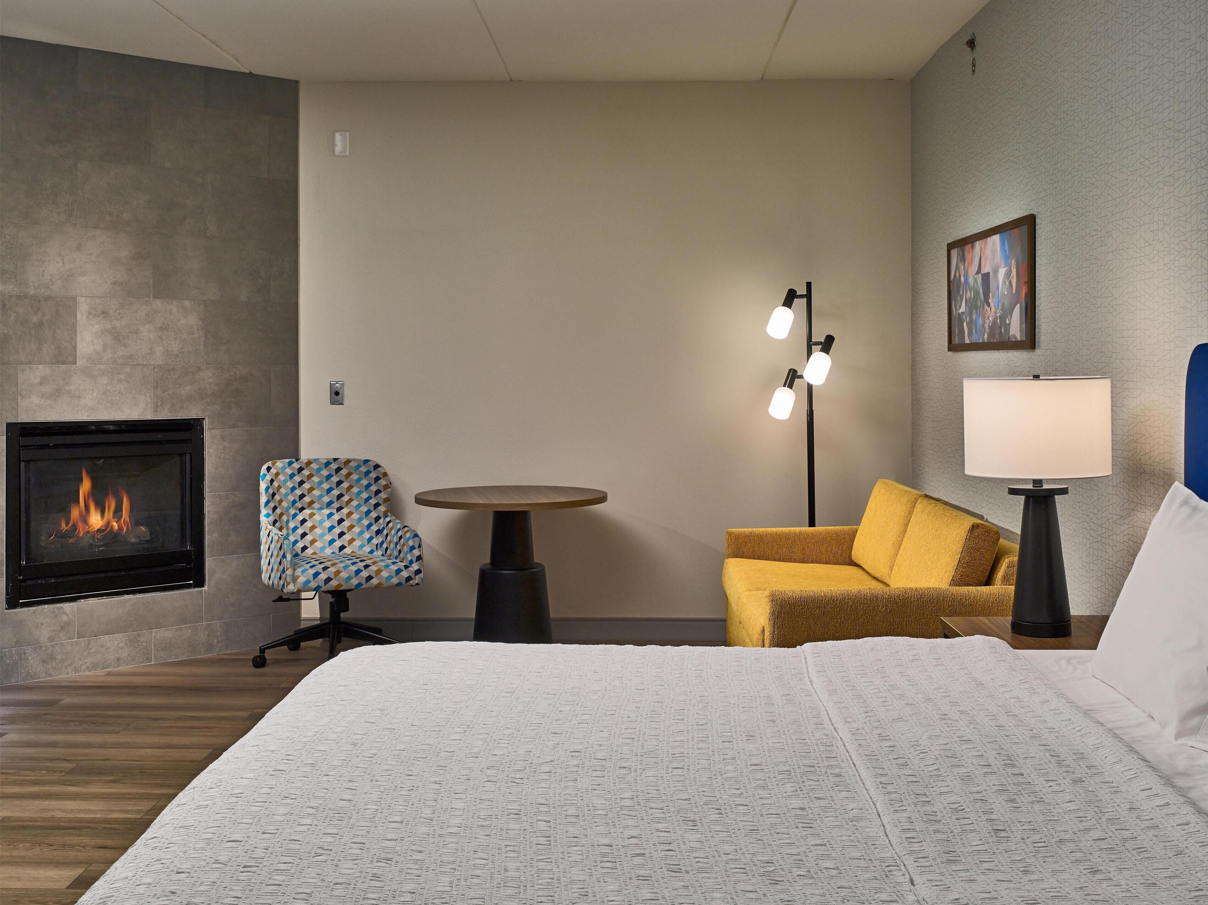 Room, 1 King Bed with Sofa bed, Fireplace | Living area | 55-inch flat-screen TV with cable channels, TV