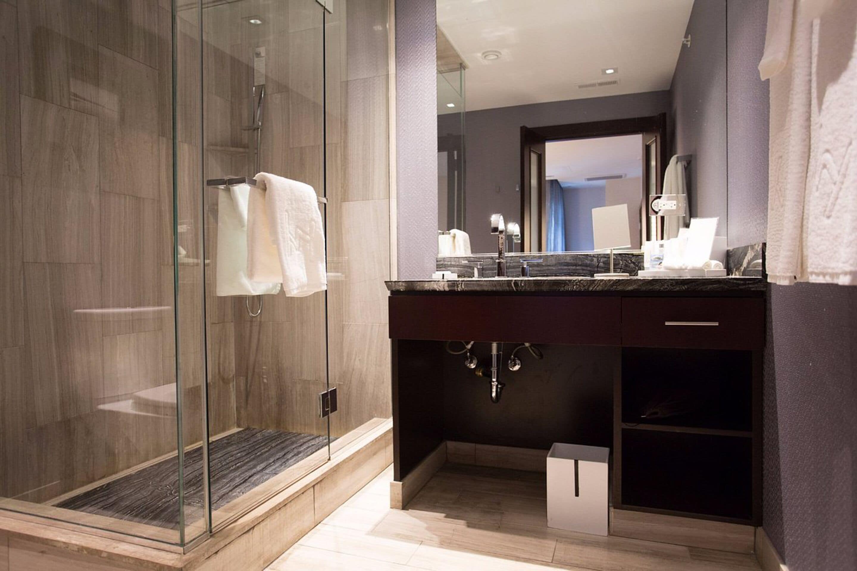 designer toiletries, hair dryer, towels