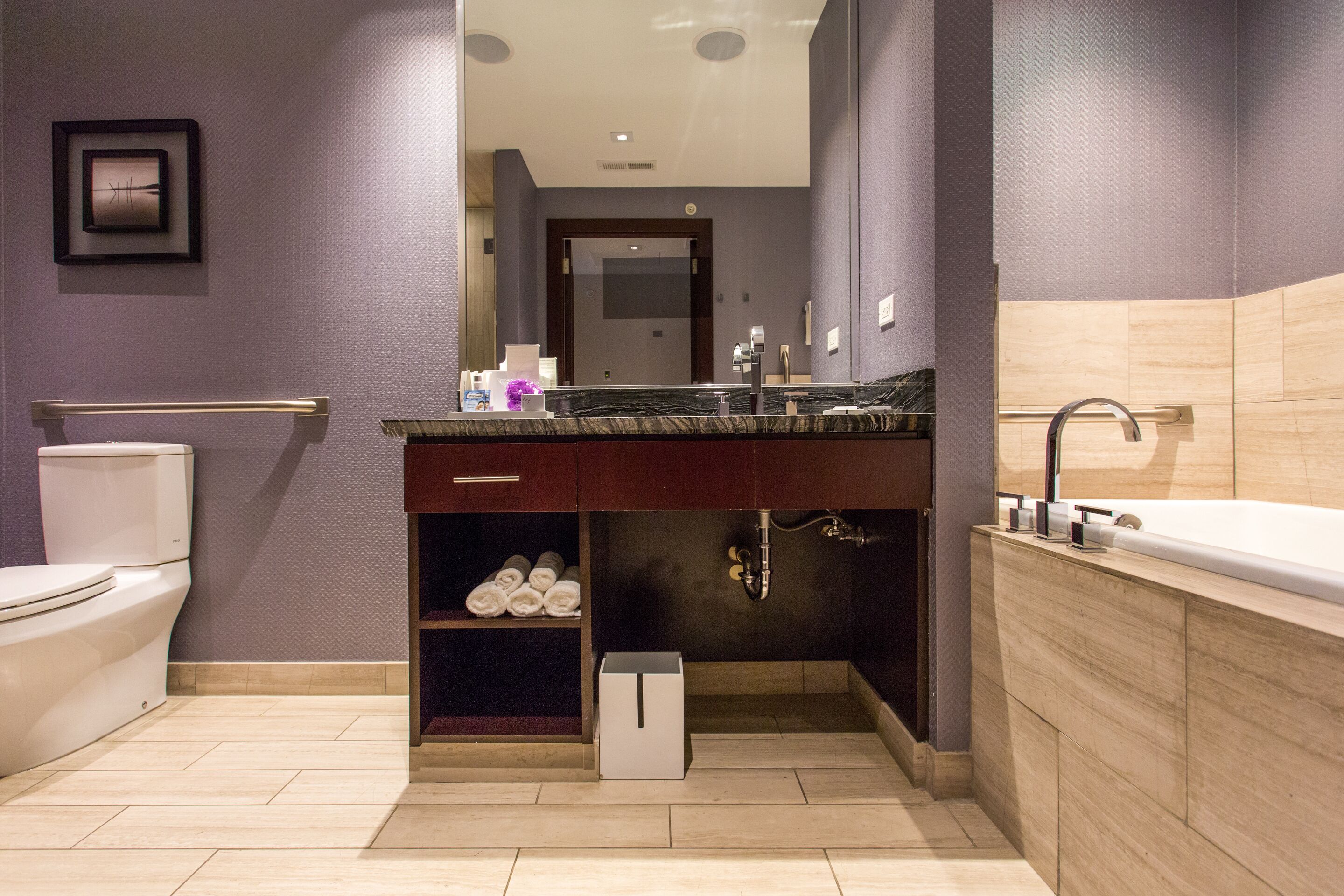 designer toiletries, hair dryer, towels