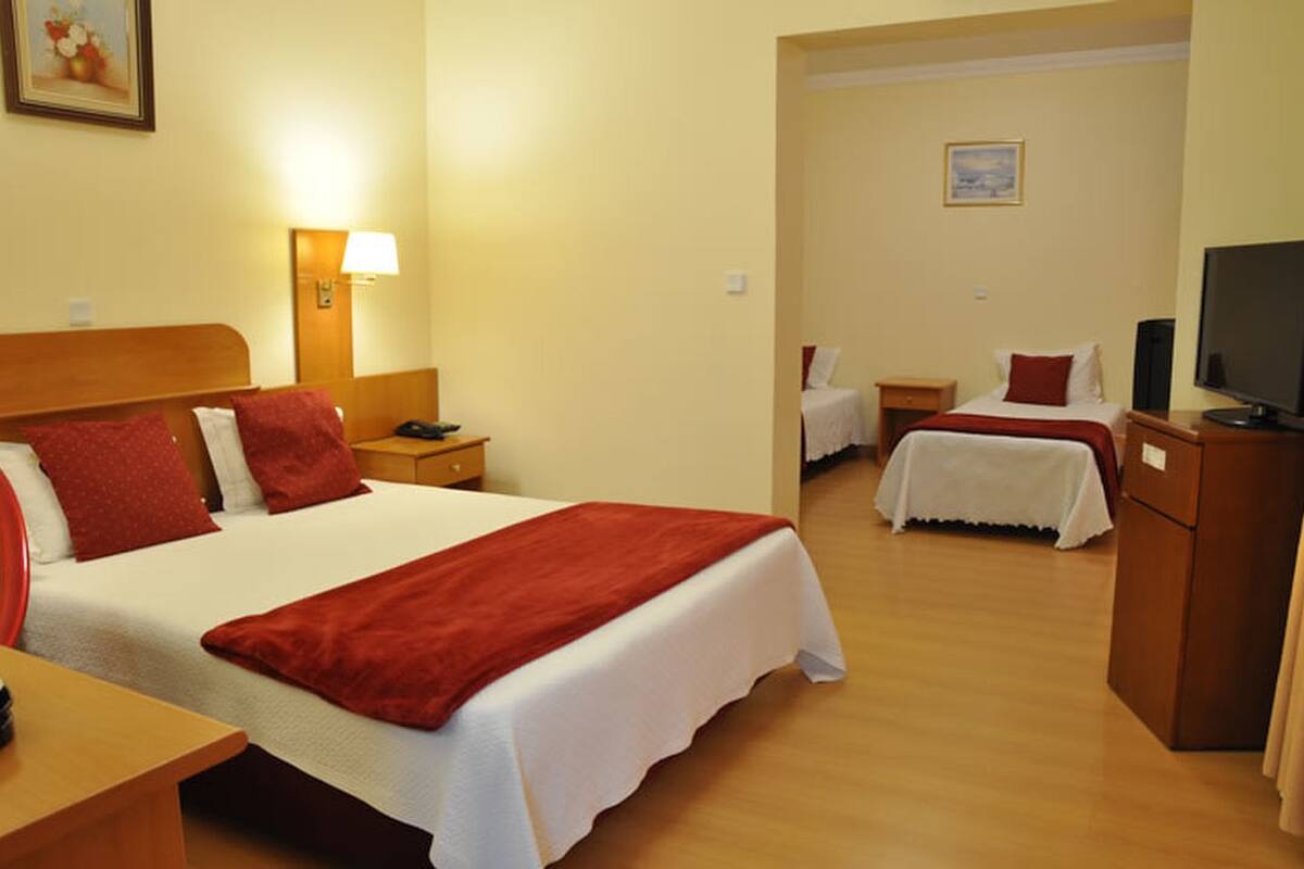 family room | 1 bedroom, minibar, in-room safe, blackout curtains